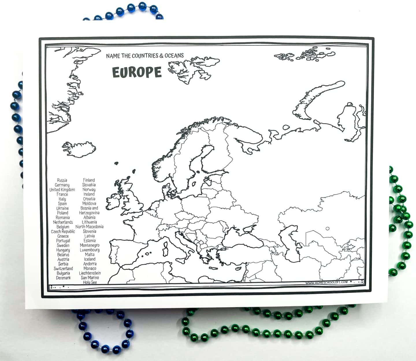 Black-and-white printable map of Europe labeled “Name the Countries & Oceans,” featuring outlined country borders and a list of European countries on the left side for reference. Decorative blue and green bead strands frame the worksheet. Designed for educational use to help students learn European geography.