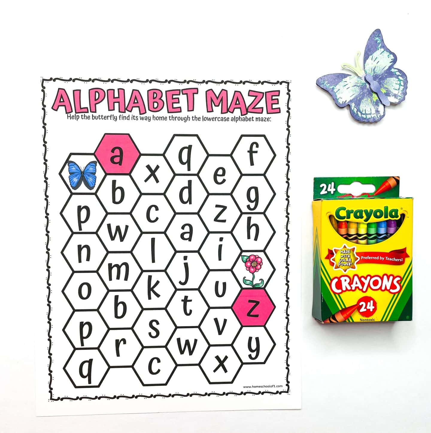 Printable butterfly alphabet maze for preschoolers featuring lowercase letters in hexagon tiles. Kids guide a butterfly from “a” to “z” to boost letter sequencing, early literacy, and pre-reading skills. Includes playful clipart and a Crayola crayon box for creative classroom fun.