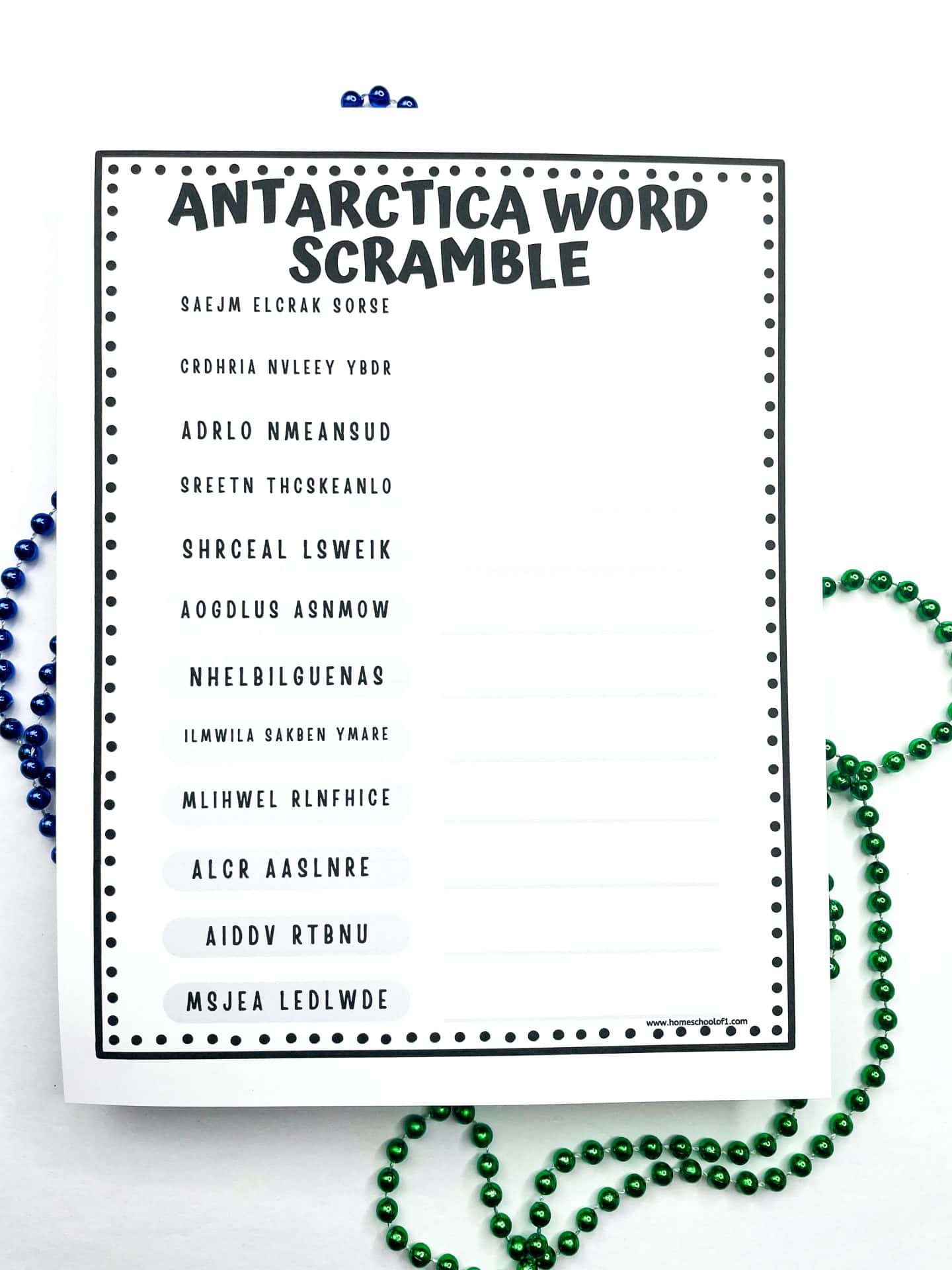 Black-and-white printable “Antarctica Word Scramble” worksheet for kids featuring jumbled explorer names like "Saejm Elcrak Sorse" and "Adrlo Nmeansud," with blank lines for answers, shown with blue and green beads.