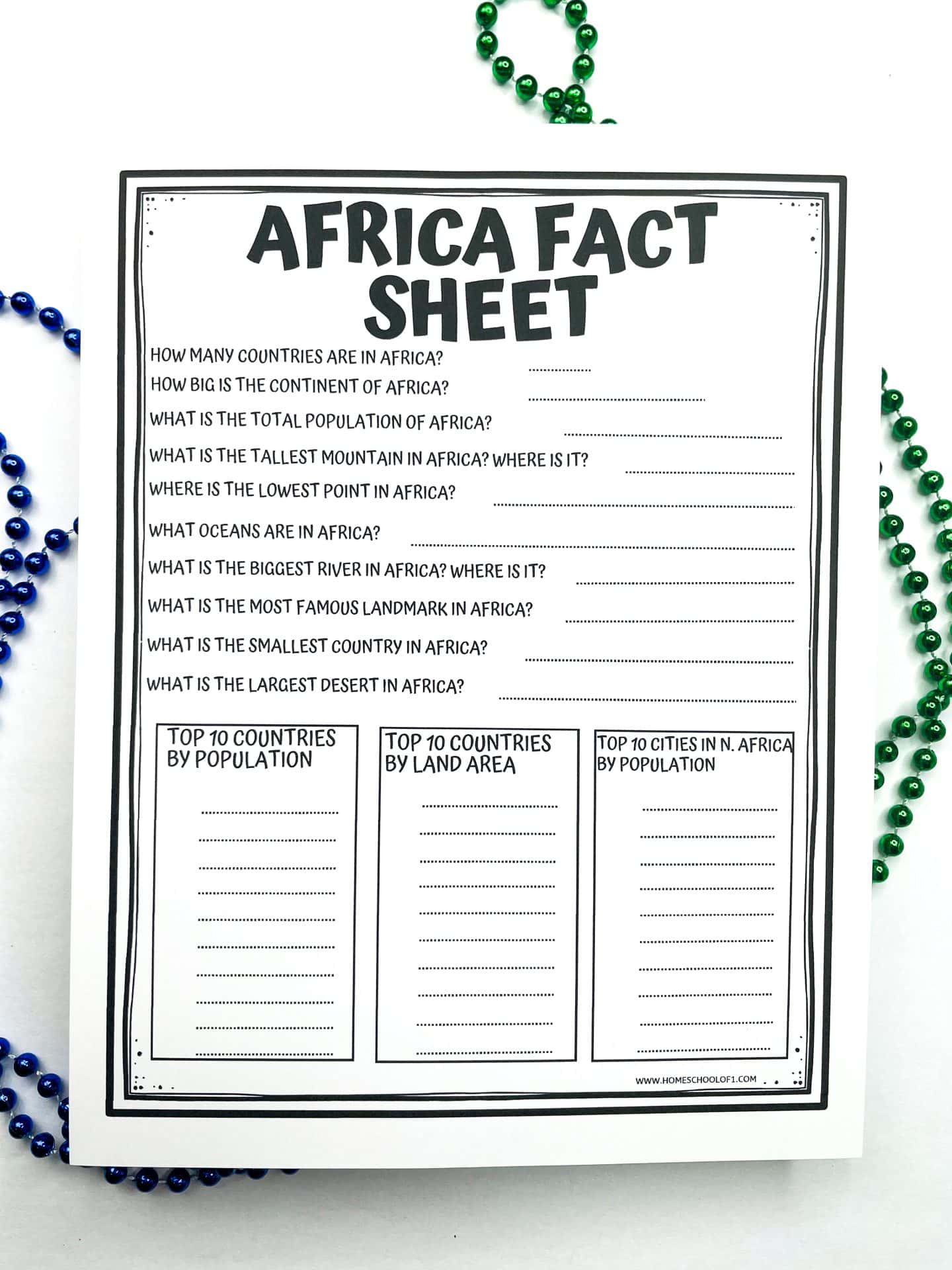 Black and white printable worksheet titled "Africa Fact Sheet" with questions about Africa’s geography, population, and landmarks, plus three blank sections for students to fill in: top 10 countries by population, top 10 by land area, and top 10 cities in North Africa by population. Green and blue beads frame the paper.