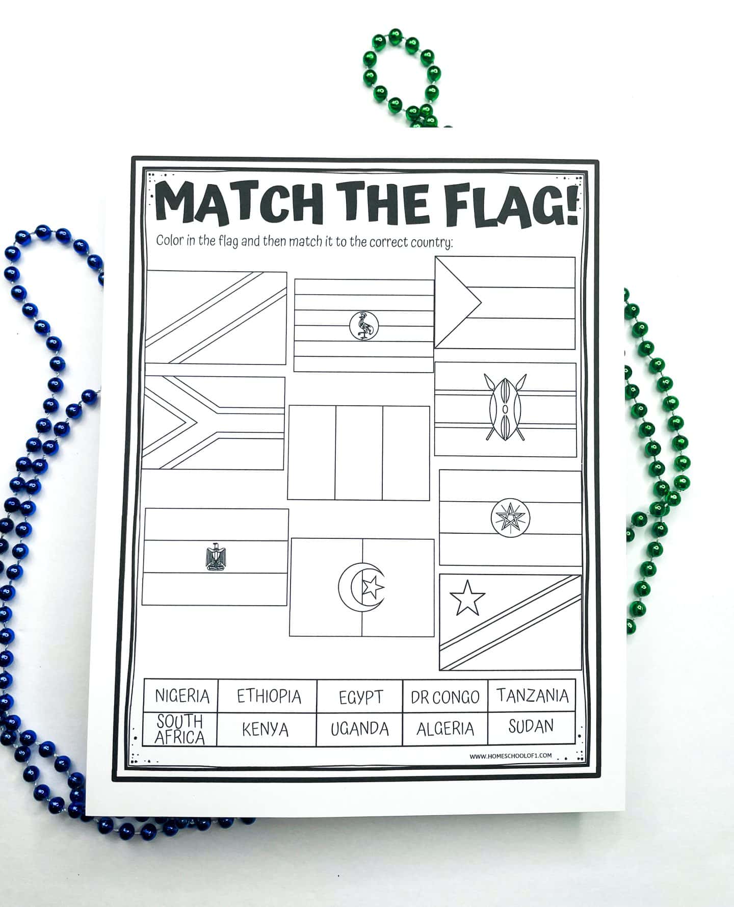 Black and white printable worksheet titled “Match the Flag!” featuring 12 outlined flags of African countries for students to color and match with the correct country name listed below, including Nigeria, Egypt, Kenya, and South Africa. Decorative green and blue beads border the worksheet.