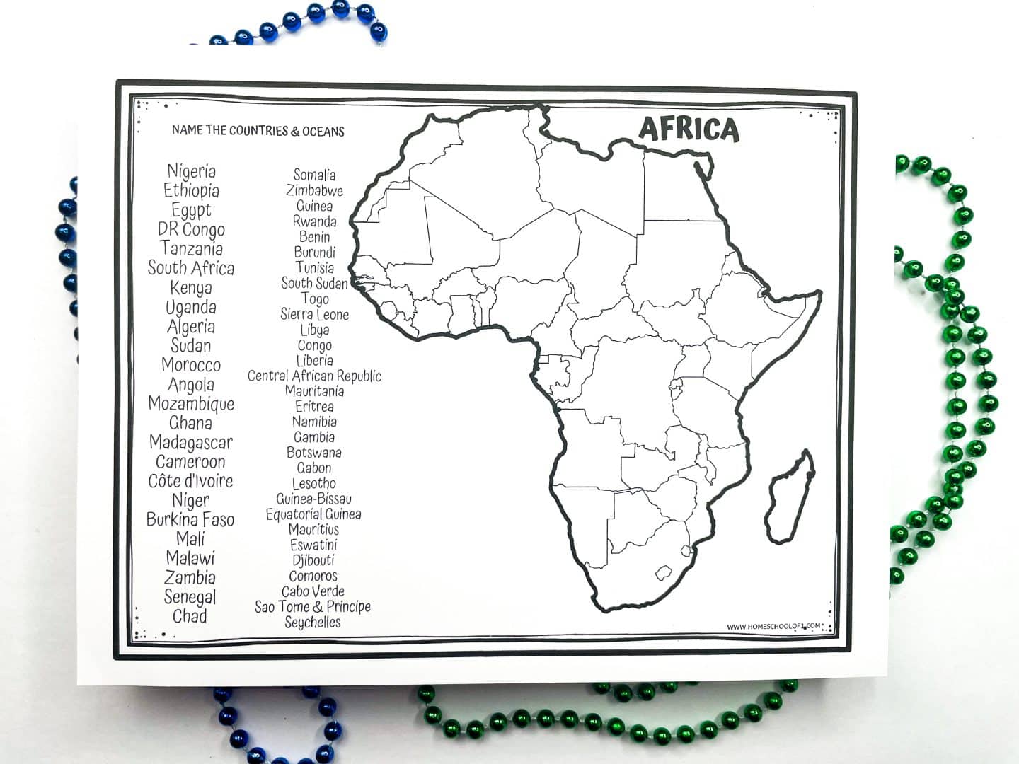 Black and white printable worksheet featuring a blank map of Africa with country borders, alongside a list of African countries for kids to identify and label on the map. The title reads "Name the Countries & Oceans," and colorful green and blue beads decorate the sides.