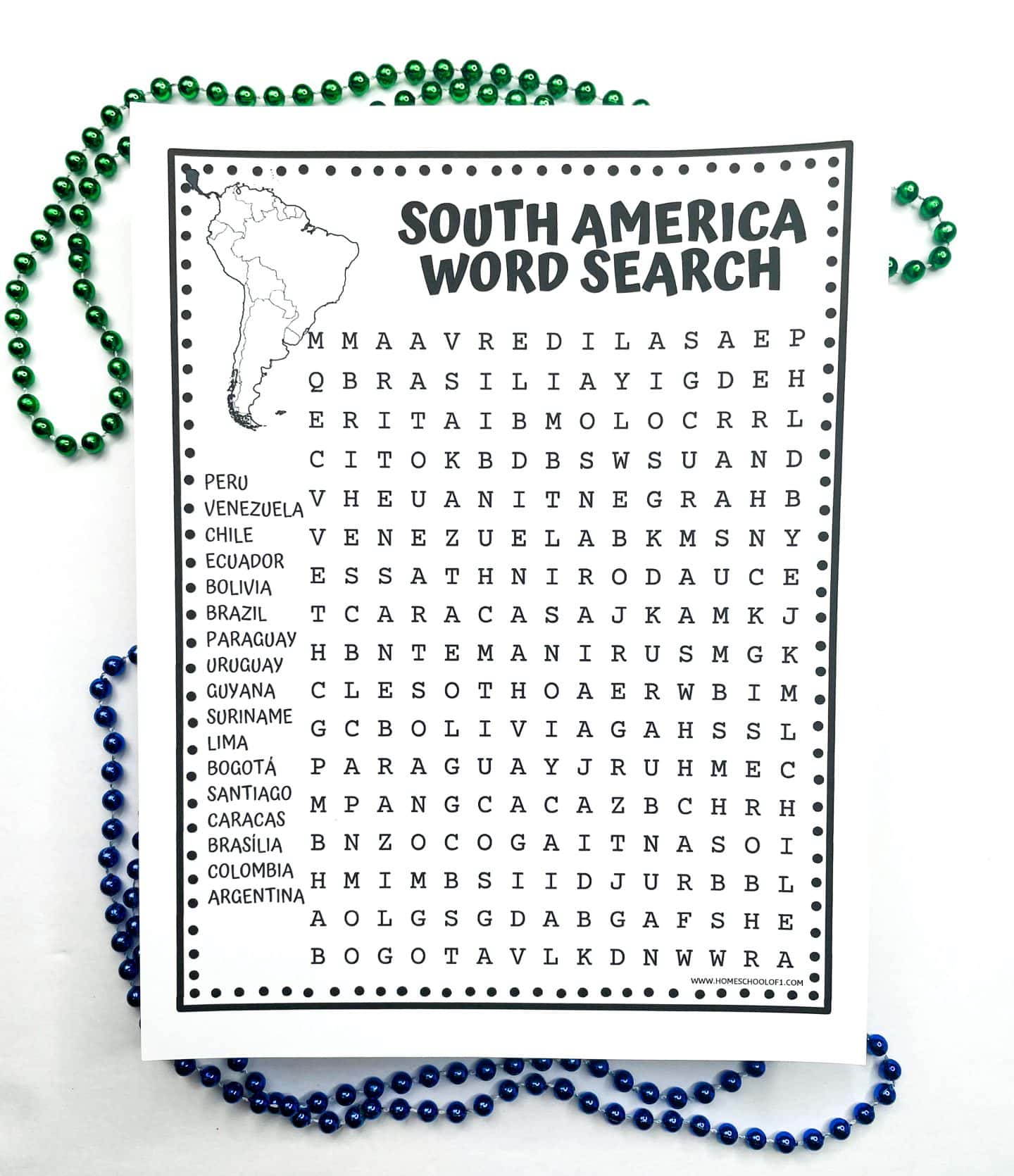 A printable “South America Word Search” worksheet features a large word grid filled with letters. To the left is a word bank listing South American countries and capital cities including Peru, Venezuela, Chile, Ecuador, Bolivia, Brazil, Argentina, Bogotá, Lima, Santiago, and more. A small outline map of South America is shown at the top. Green and blue bead necklaces surround the page decoratively.
