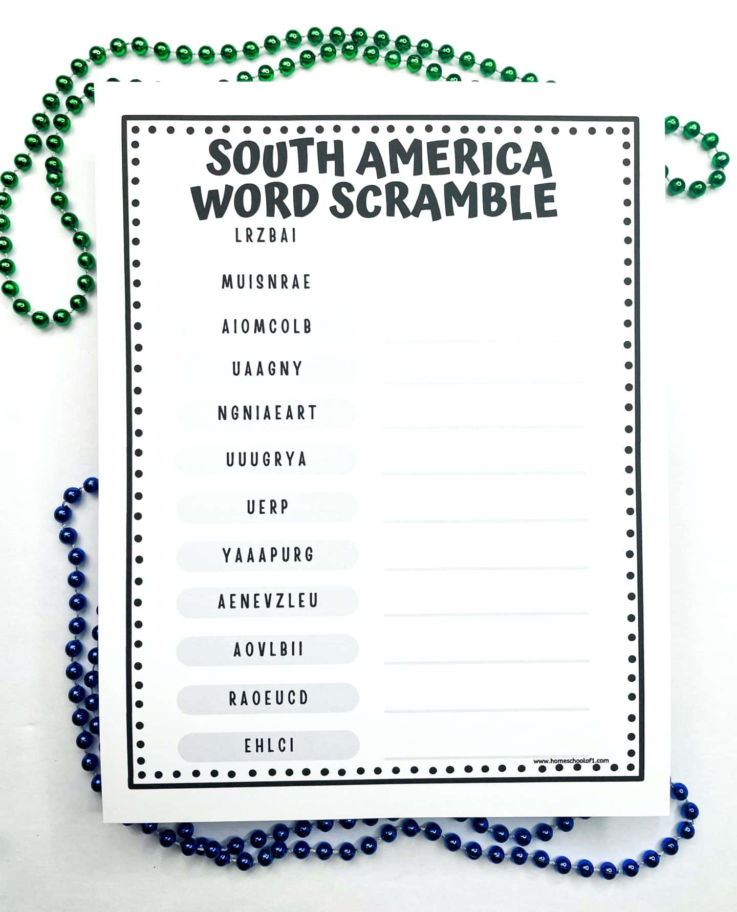 A printable worksheet titled “South America Word Scramble” features a list of scrambled country names such as “LRZBAI,” “MUISNRAE,” and “AIOMCOLB.” Blank lines are provided beside each scrambled word for students to write the correct country name. The worksheet is bordered by a dotted pattern and decorated with green and blue bead necklaces around it.