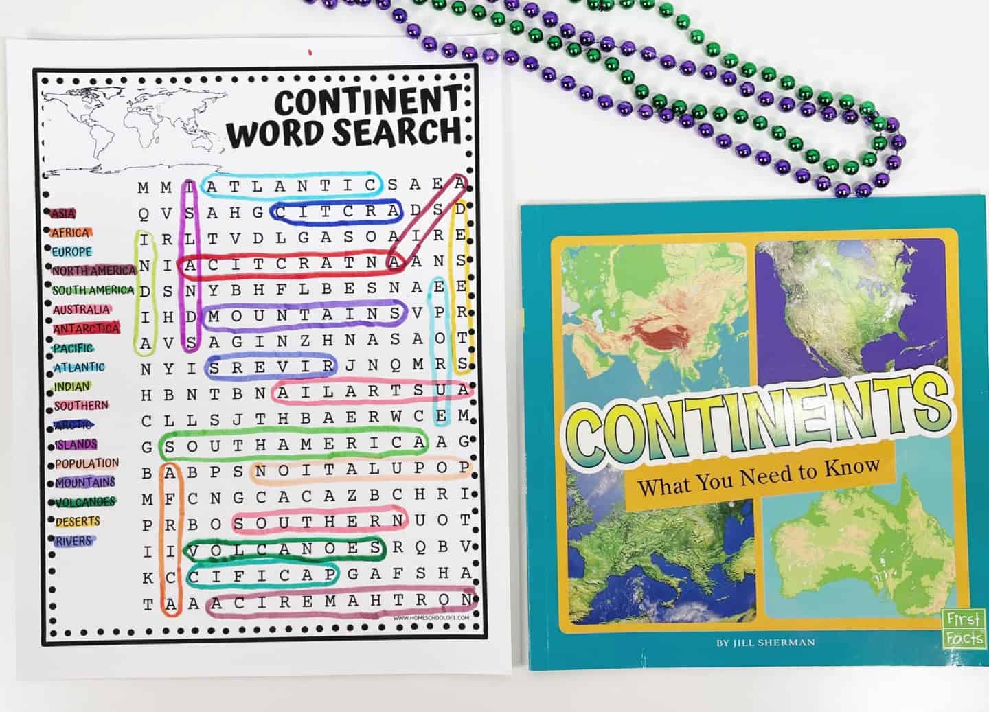 A completed continent word search worksheet featuring colorful circled answers like Asia, Europe, Pacific, and South America, alongside a geography book titled Continents: What You Need to Know. The worksheet includes terms related to continents, oceans, and landforms, making it a fun and educational resource for learning world geography. Perfect for homeschooling, classrooms, or geography-themed activity days.

