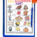 Colorful fall scavenger hunt printable for kids featuring autumn-themed items on a clipboard with seasonal decorations.