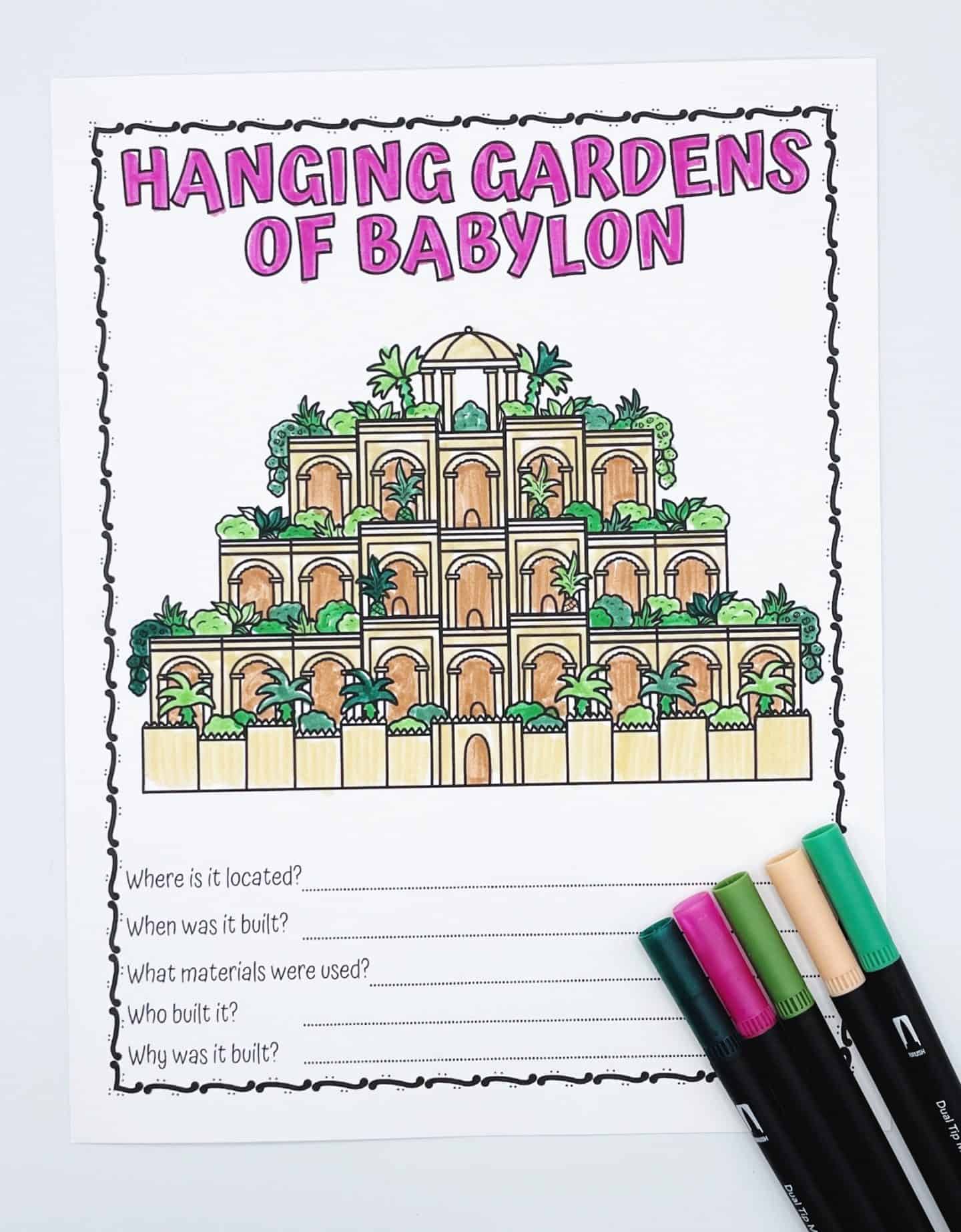 Illustrated worksheet titled "Hanging Gardens of Babylon" with a drawing of the gardens and five fill-in-the-blank questions. Four colored markers rest beside the page.