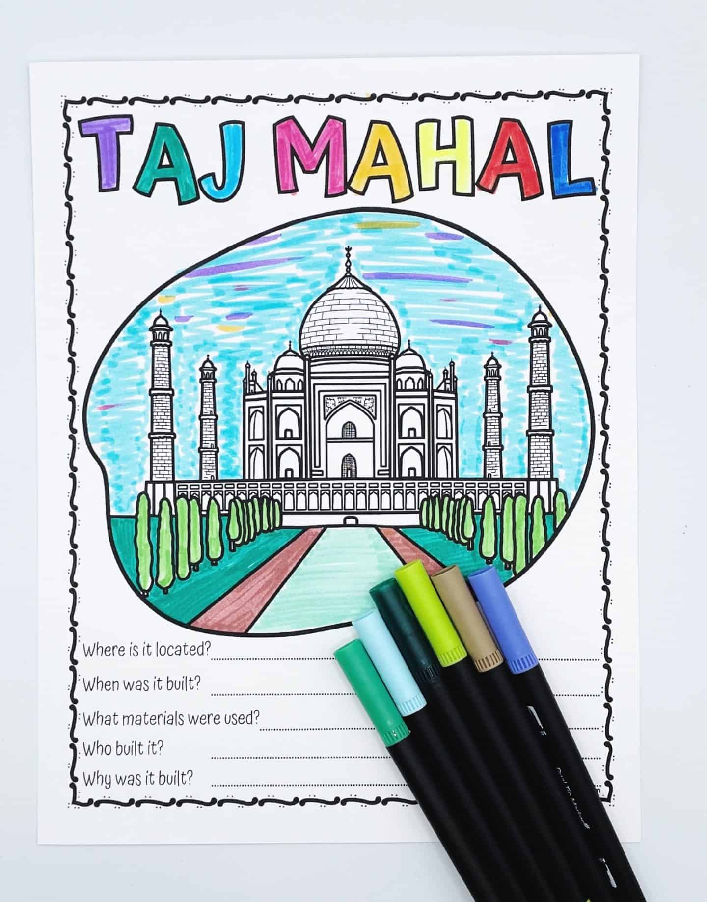  A kid-friendly Taj Mahal coloring worksheet, partially colored in with bright markers. The top reads "Taj Mahal" in colorful bubble letters, with a black-and-white drawing of the monument below, surrounded by blue sky, green trees, and a red walkway. At the bottom, there are five questions: Where is it located? When was it built? What materials were used? Who built it? Why was it built?