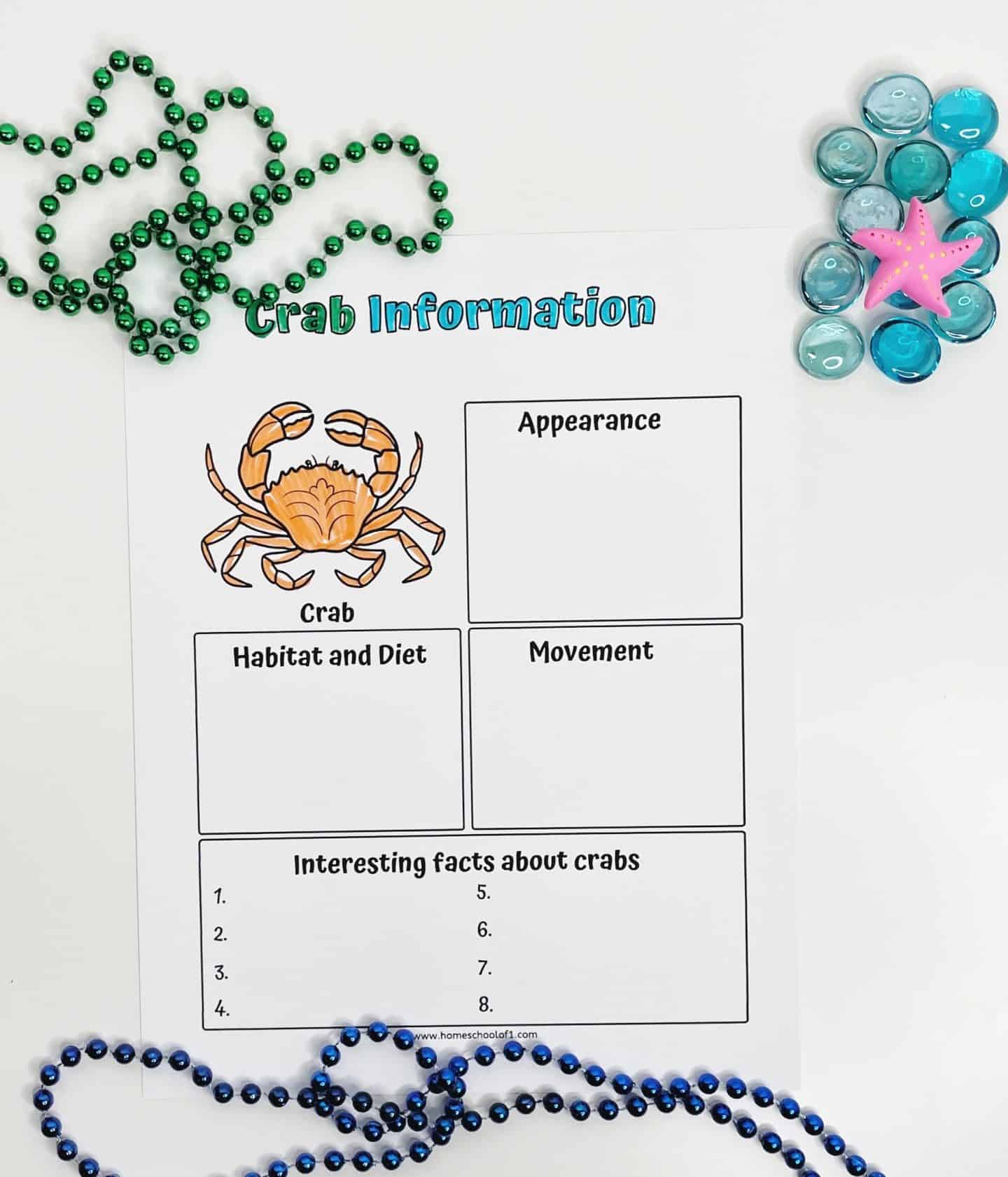 Crab information worksheet for kids with sections to fill in about a crab’s appearance, habitat and diet, movement, and interesting facts, featuring a cartoon crab and surrounded by sea-themed beads and pebbles.