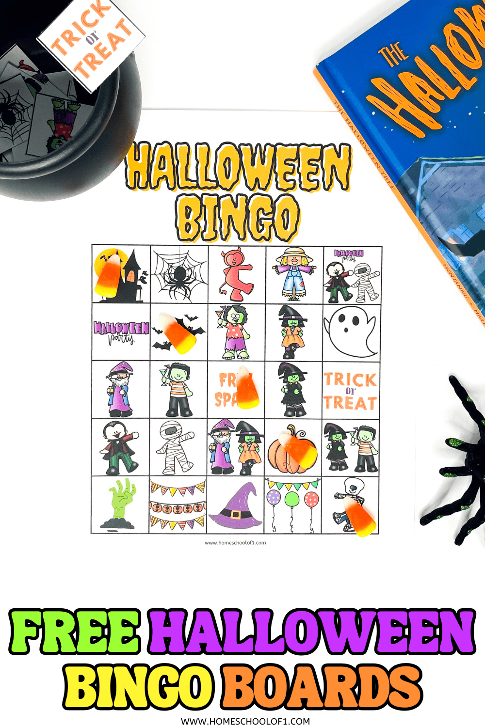 Halloween bingo printable card with candy corn markers, a trick-or-treat sign, and a copy of The Halloween Tree book.

