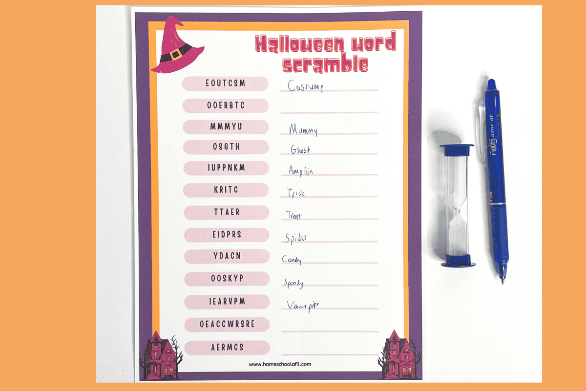 completed halloween word scramble worksheet with a sand timer and a pen