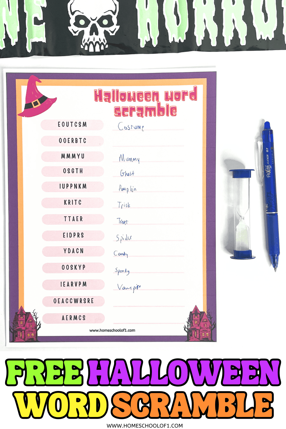 Free Halloween word scramble printable worksheet with 13 spooky scrambled words and handwritten answers, shown with pen and timer for a fun classroom or homeschool activity.

