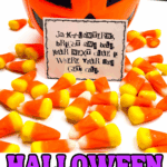 Printable Halloween candy scavenger hunt clue next to pumpkin bucket and candy corn