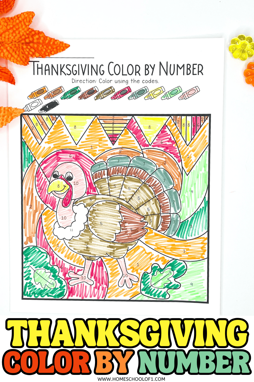 Completed turkey-themed Thanksgiving color by number worksheet colored with crayons

