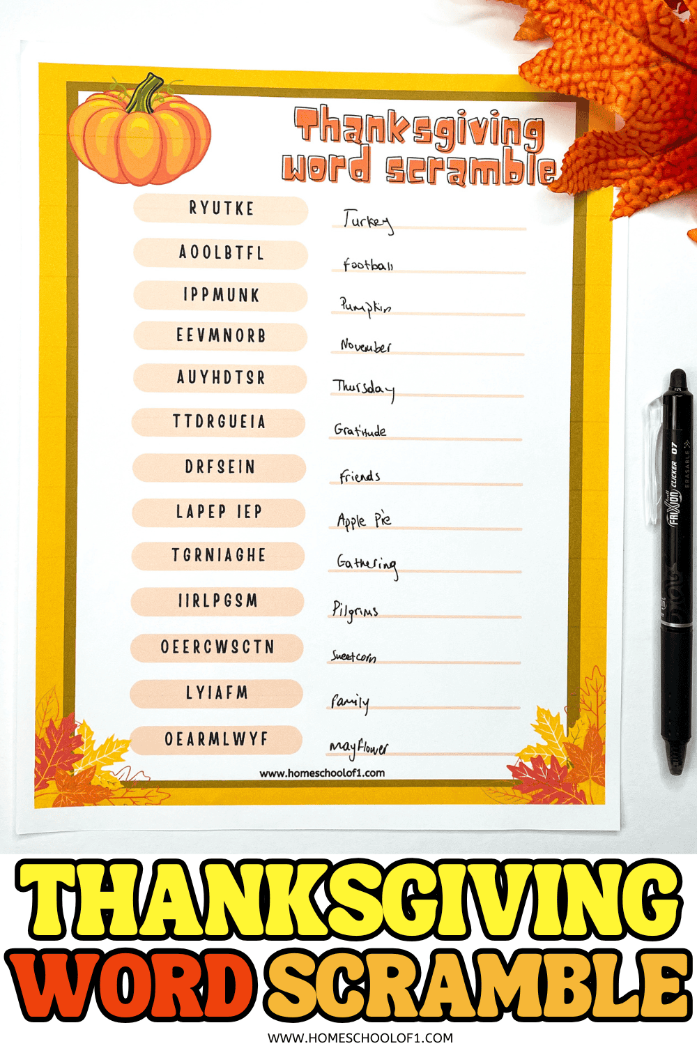 Completed Thanksgiving word scramble worksheet with handwritten answers and fall decorations

