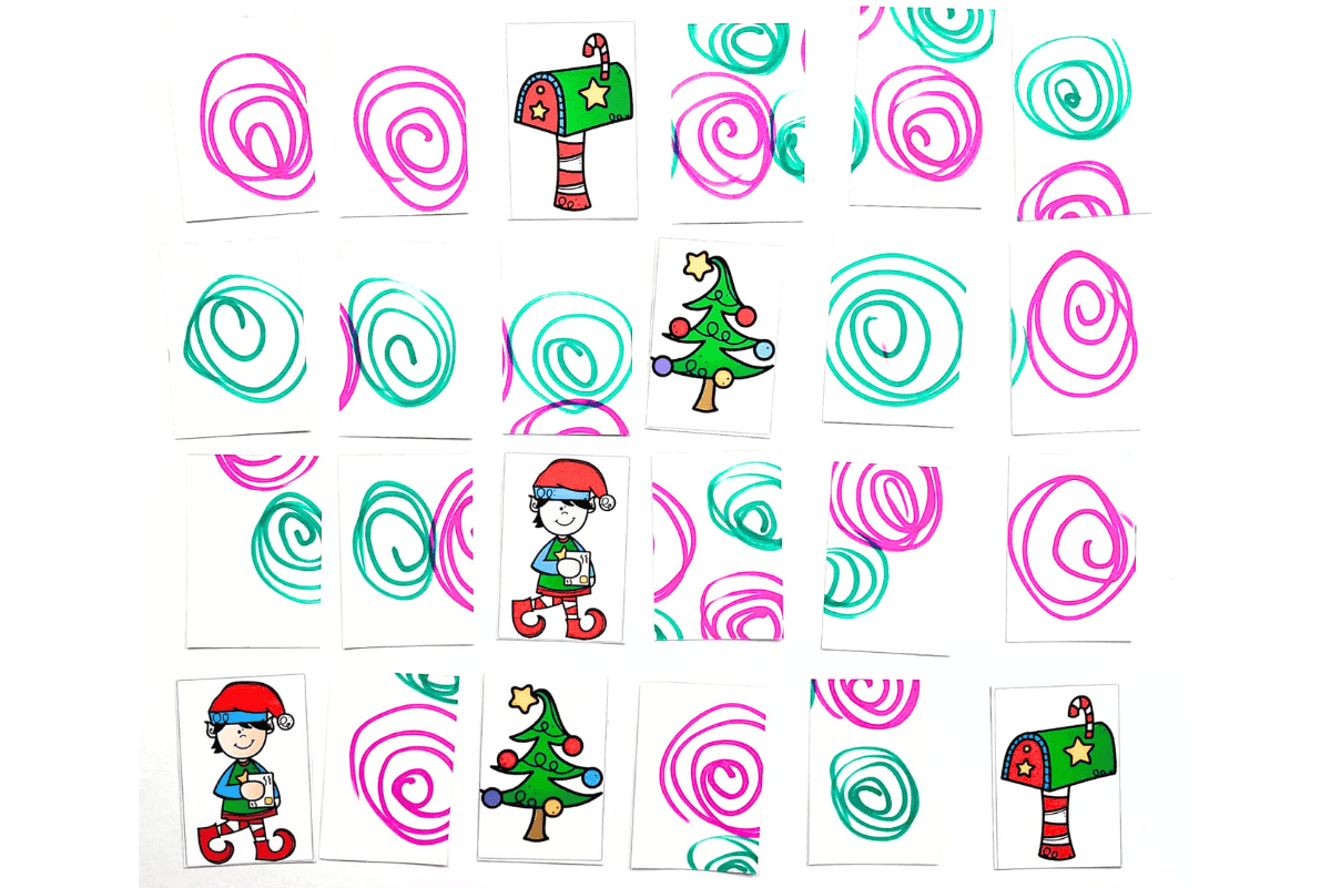 Cards from the Elf on the Shelf matching game laid out on a table, showing elves, mailboxes, and Christmas trees with colorful swirl backs.
