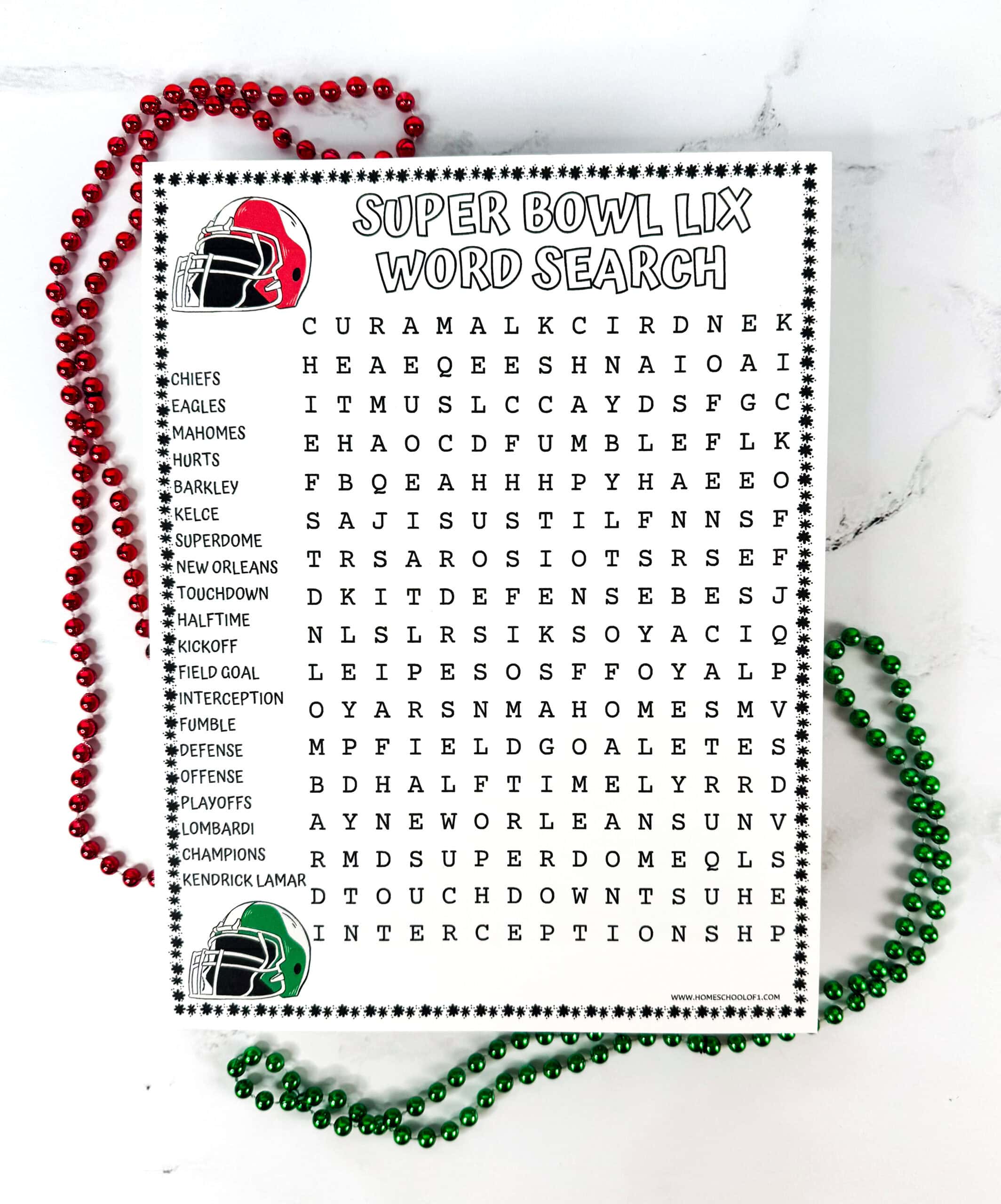 A Super Bowl LIX word search printable surrounded by red and green beaded necklaces on a white marble background. The word search includes football-related terms like Chiefs, Eagles, Mahomes, Superdome, Touchdown, Halftime, Lombardi, and Kendrick Lamar, with red and green football helmet graphics on each corner.