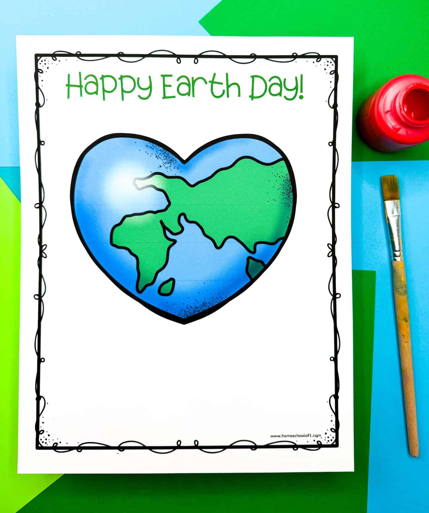 Earth Day art printable featuring a large heart-shaped Earth illustration with green continents and blue oceans, under the heading “Happy Earth Day!” in green text. The design is framed with a playful border and set on a colorful blue and green background, with a red paint jar and paintbrush to the side.

