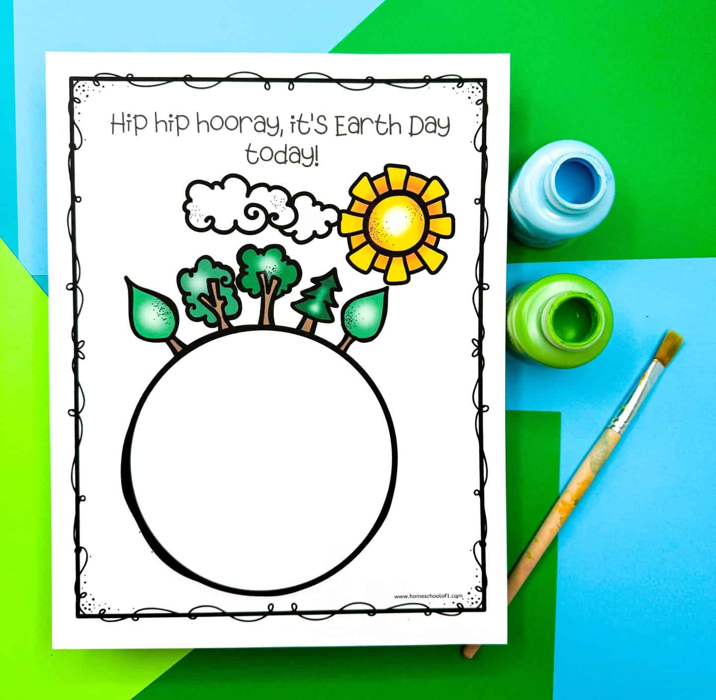 Earth Day craft template featuring a round Earth outline with trees, leaves, a cloud, and a bright yellow sun sprouting from the top. Above the design, the text reads “Hip hip hooray, it’s Earth Day today!” The printable is set on a colorful blue and green background with open green and blue paint jars and a brush nearby.

