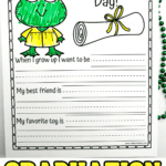Close-up of a single "It's Graduation Day!" worksheet showing a green cartoon frog in a yellow graduation gown and cap. The worksheet prompts kids to write about what they want to be when they grow up, their best friend, and their favorite toy.