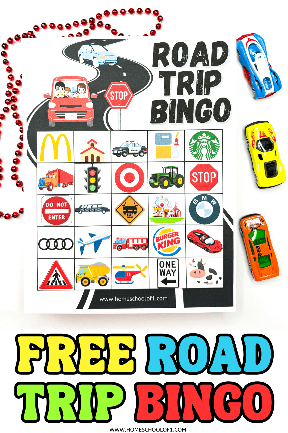 A "Road Trip Bingo" printable card surrounded by a red beaded necklace and colorful toy cars; the bingo sheet shows travel-themed symbols like a carnival tent, Target logo, Burger King logo, airplane, and various road signs.


