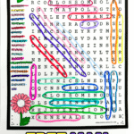 Close-up of a completed May word search puzzle showing all 20 spring-related words highlighted in color. Surrounded by cheerful hand-drawn flowers and the title “May Word Search” in red and pink, with bold text at the bottom reading “FREE MAY WORD SEARCH” in colorful block letters.