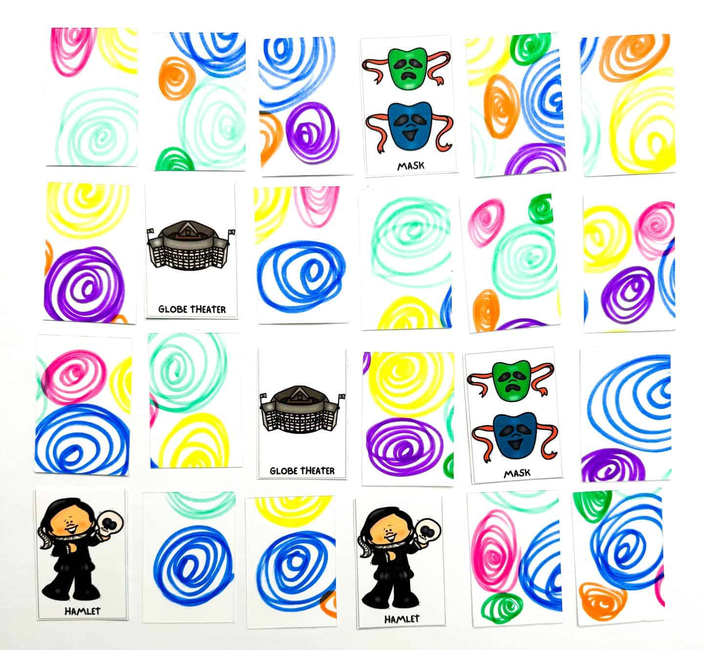Part of a 'Shakespeare Memory Game' in progress, with cards showing colorful swirl patterns on one side and illustrations of a mask, Globe Theater, and Hamlet on the other.