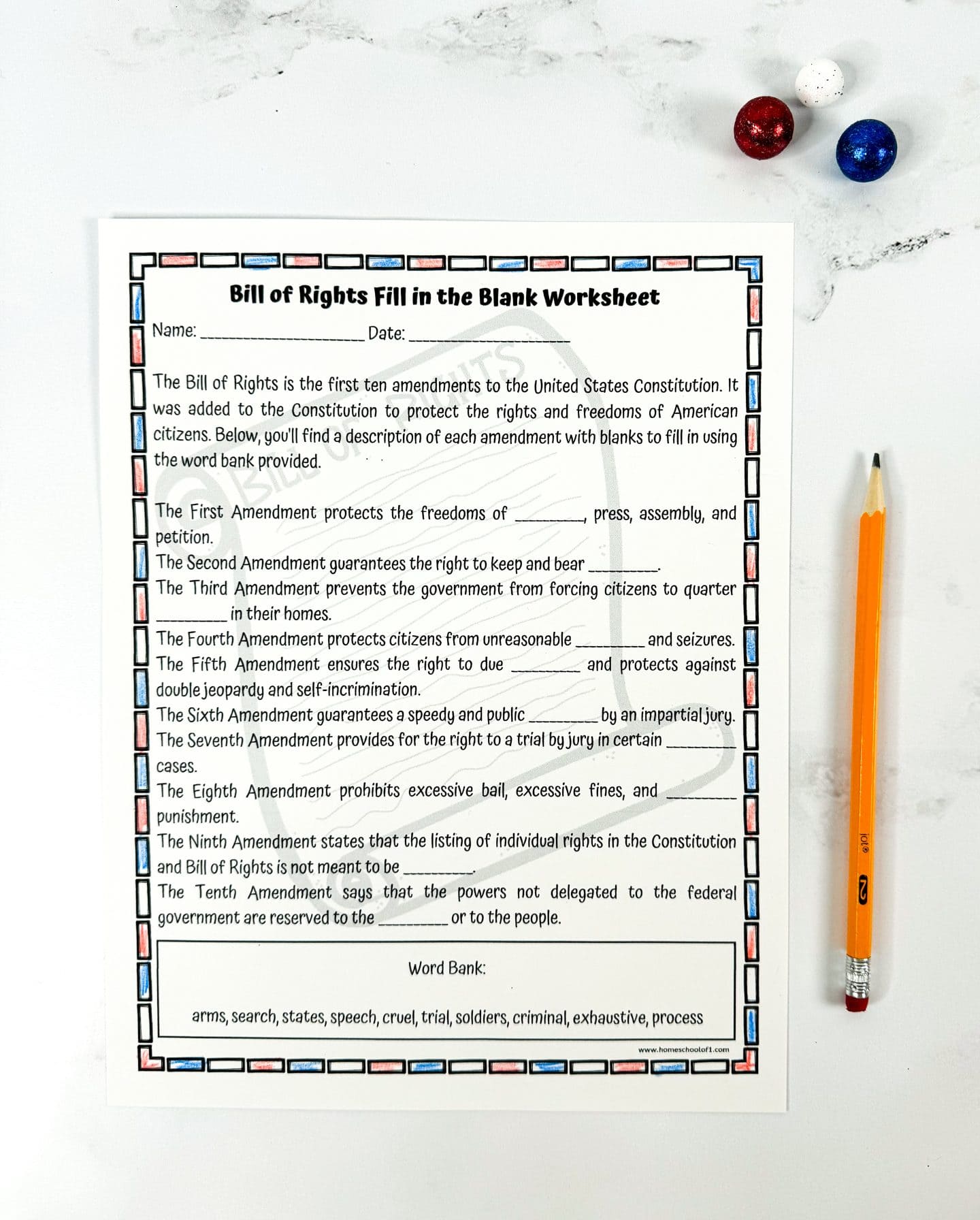 A completed "Bill of Rights Fill in the Blank Worksheet" for students, bordered with alternating red, white, and blue rectangles. The answers are handwritten in the blanks, matching each amendment to a concept from the word bank. Some of the filled-in answers include "speech," "arms," "soldiers," "search," "process," and "trial." A yellow pencil lies to the right of the page, and red, white, and blue glittery balls are placed in the top right corner on a white marble surface.