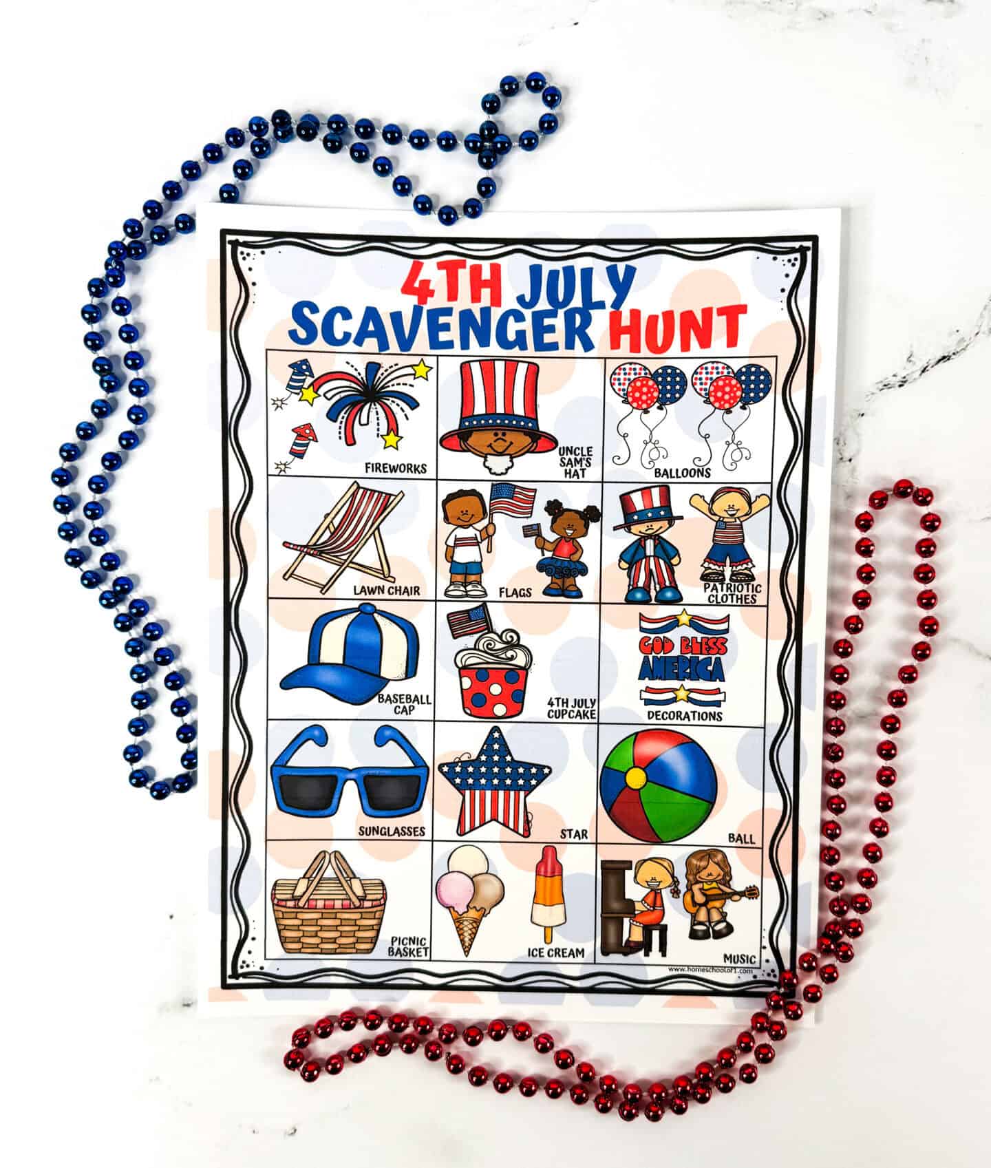 A flat-lay photo of a 4th of July scavenger hunt printable on a marble surface, framed by red and blue bead necklaces. The activity sheet features cheerful illustrations of classic Independence Day items including fireworks, patriotic clothes, picnic basket, sunglasses, ice cream, and a "God Bless America" decoration.