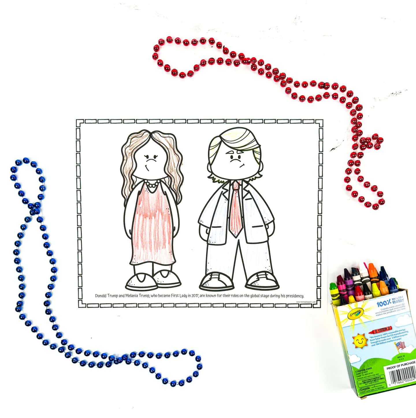 A coloring worksheet features cartoon versions of Donald Trump and Melania Trump, with Melania in a red dress and Donald in a suit and red tie. The caption explains their roles during Trump’s presidency, noting Melania became First Lady in 2017. Red and blue bead necklaces and a Crayola crayon box frame the scene, adding a festive classroom feel.
