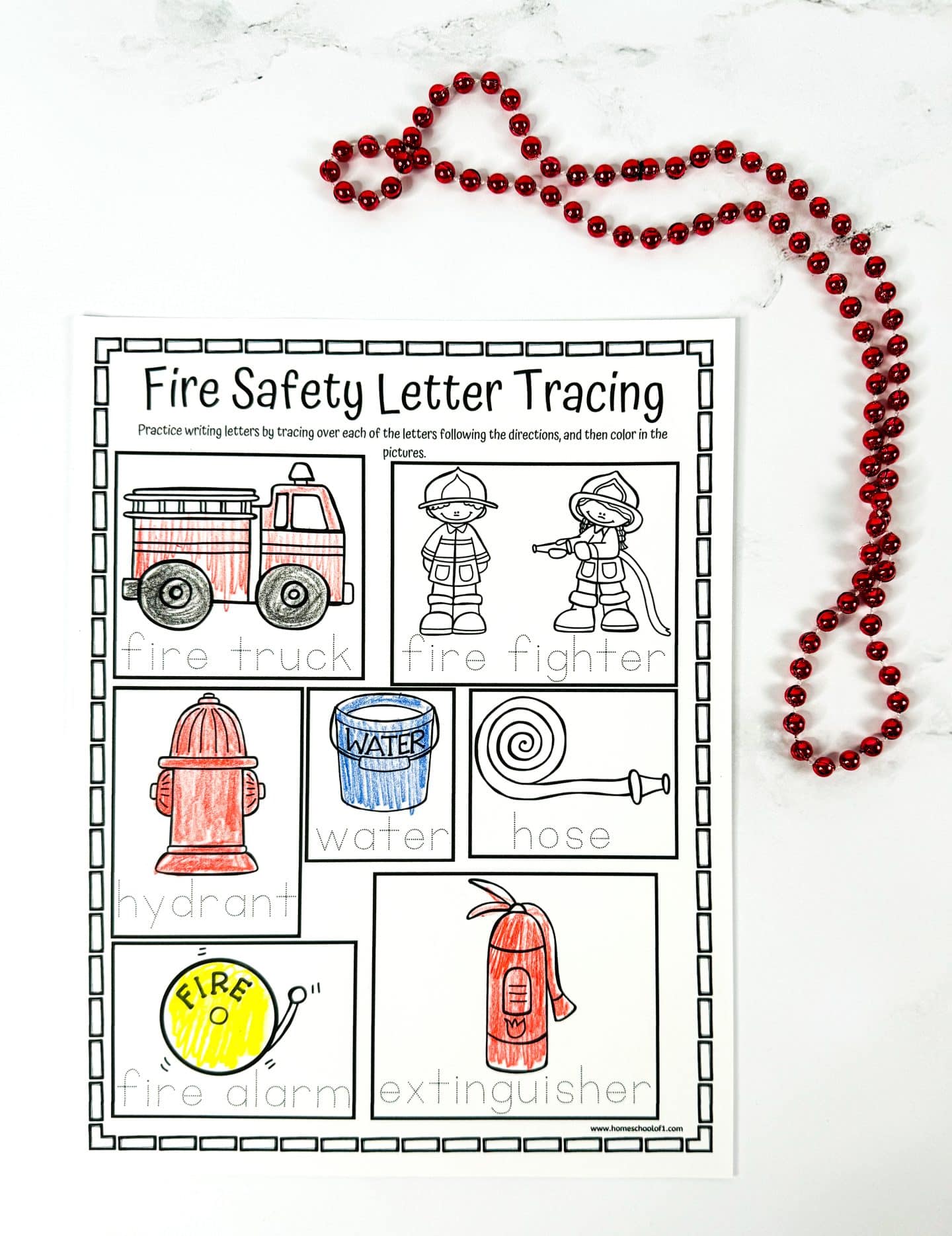 Fire safety letter tracing worksheet with illustrations and traceable words: fire truck, fire fighter, hydrant, water, hose, fire alarm, and extinguisher. Each word is paired with a colored drawing to support early writing and fire safety vocabulary.

