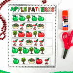 Free printable apple sequencing worksheet with scissors and glue stick for kids to complete patterns using apple-themed images.