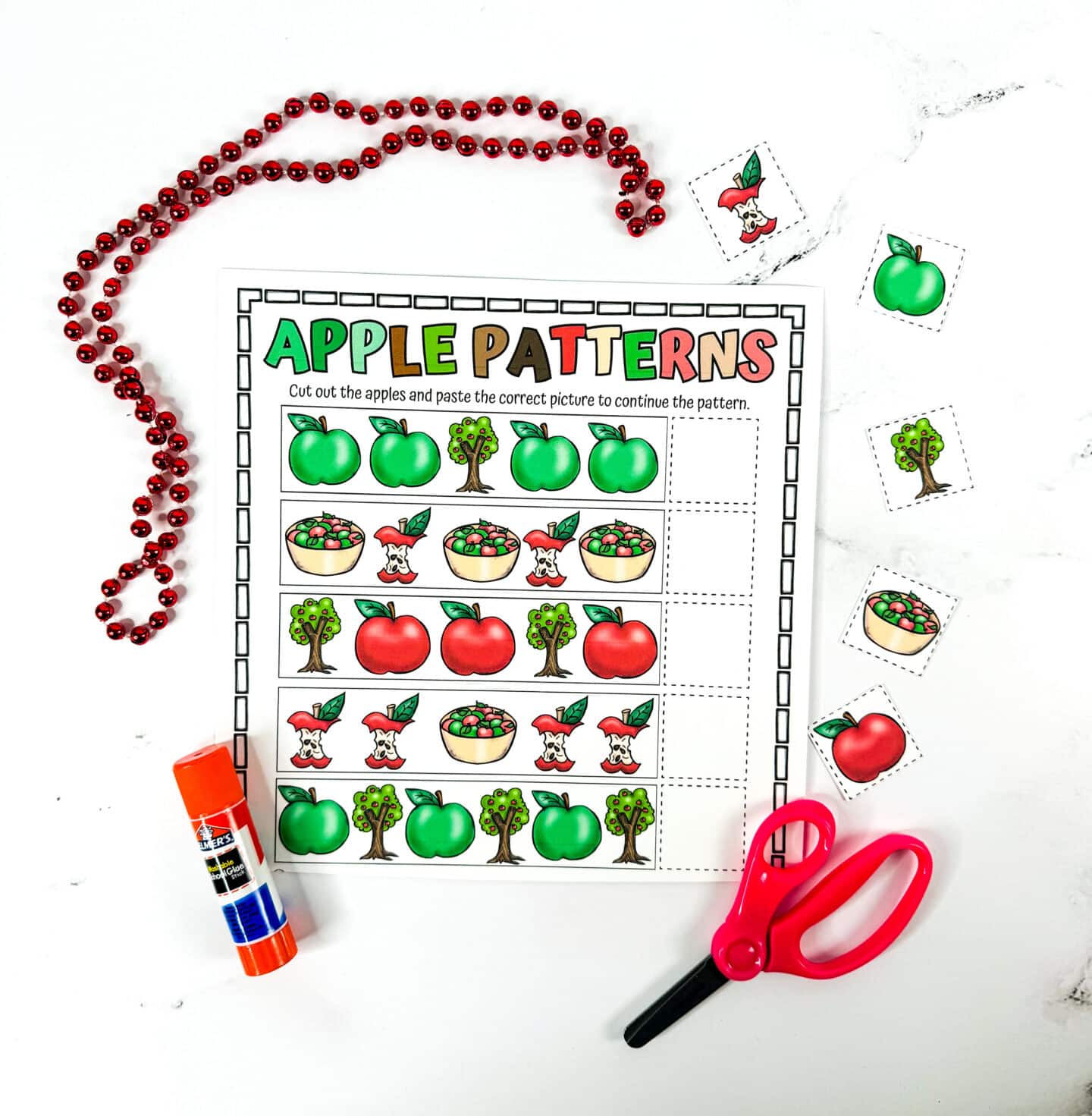 free printable apple patterns worksheet with glue stick and scissors and the images cut out