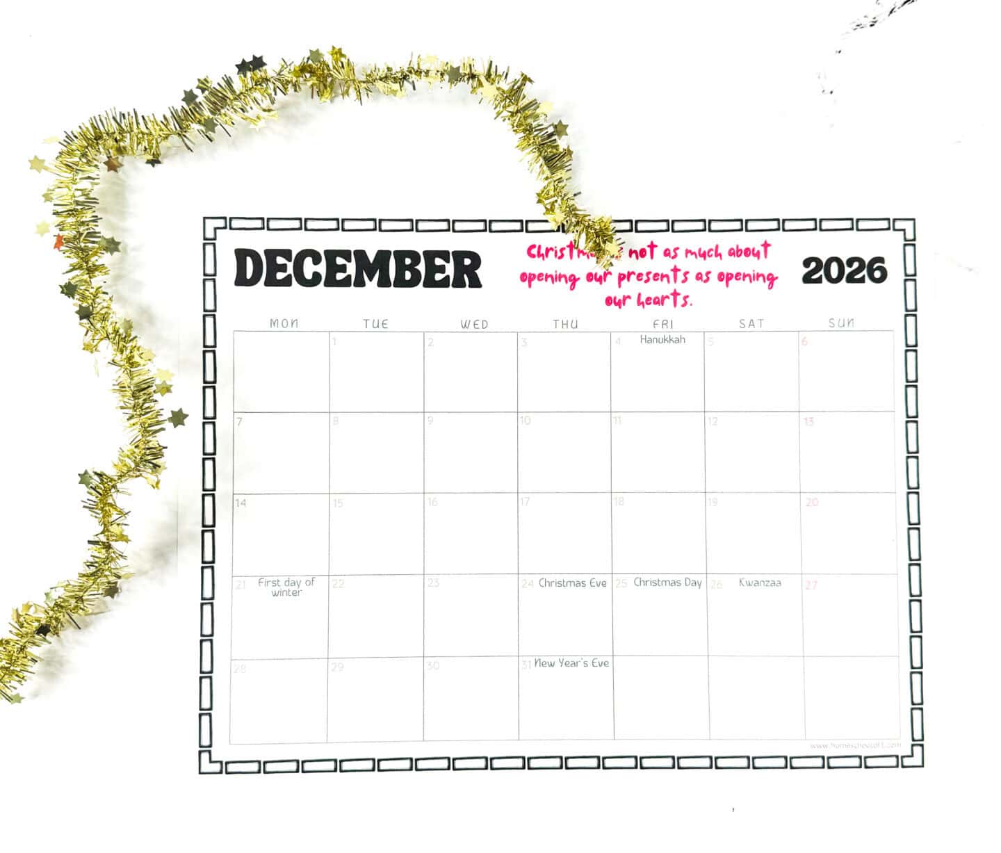 December 2026 printable calendar page featuring major holidays like Hanukkah, Christmas Eve, Christmas Day, Kwanzaa, and New Year’s Eve, decorated with gold tinsel.