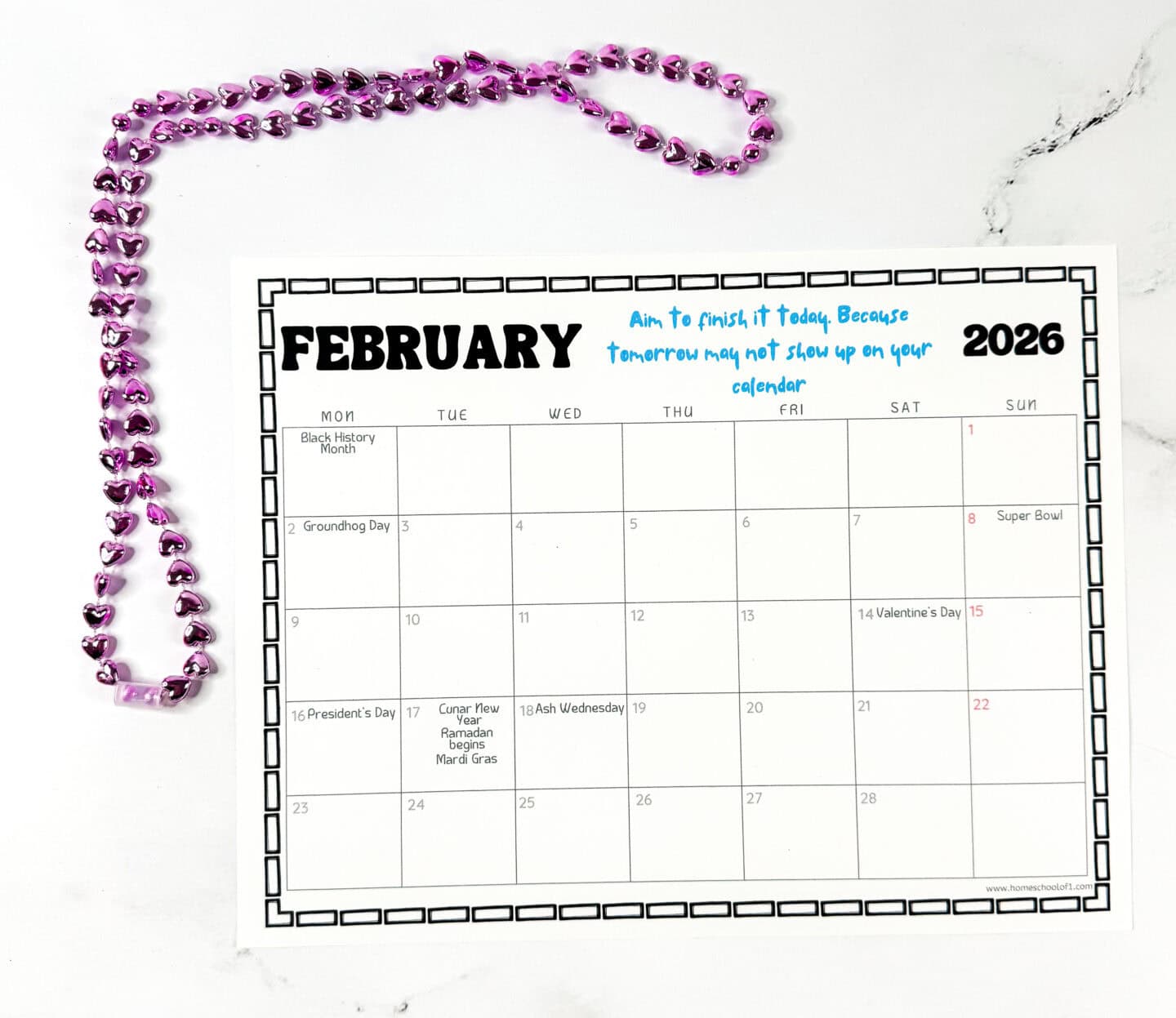 February 2026 printable calendar page with Valentine’s Day, Presidents Day, Groundhog Day, Mardi Gras, and Lunar New Year, styled with pink heart-shaped beads.