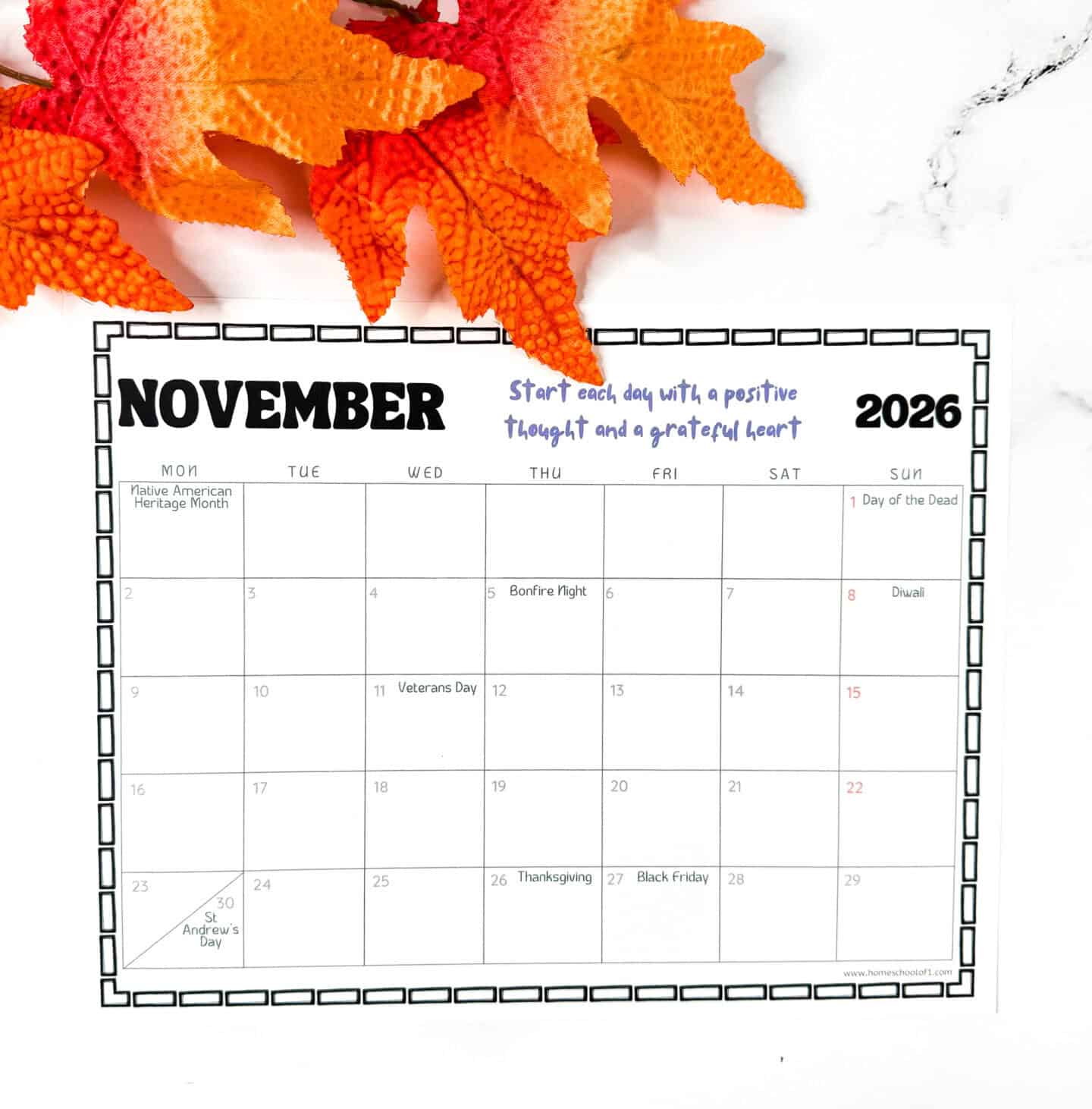 November 2026 printable calendar page with holidays including Veterans Day, Thanksgiving, Black Friday, and Diwali, styled with autumn leaves.