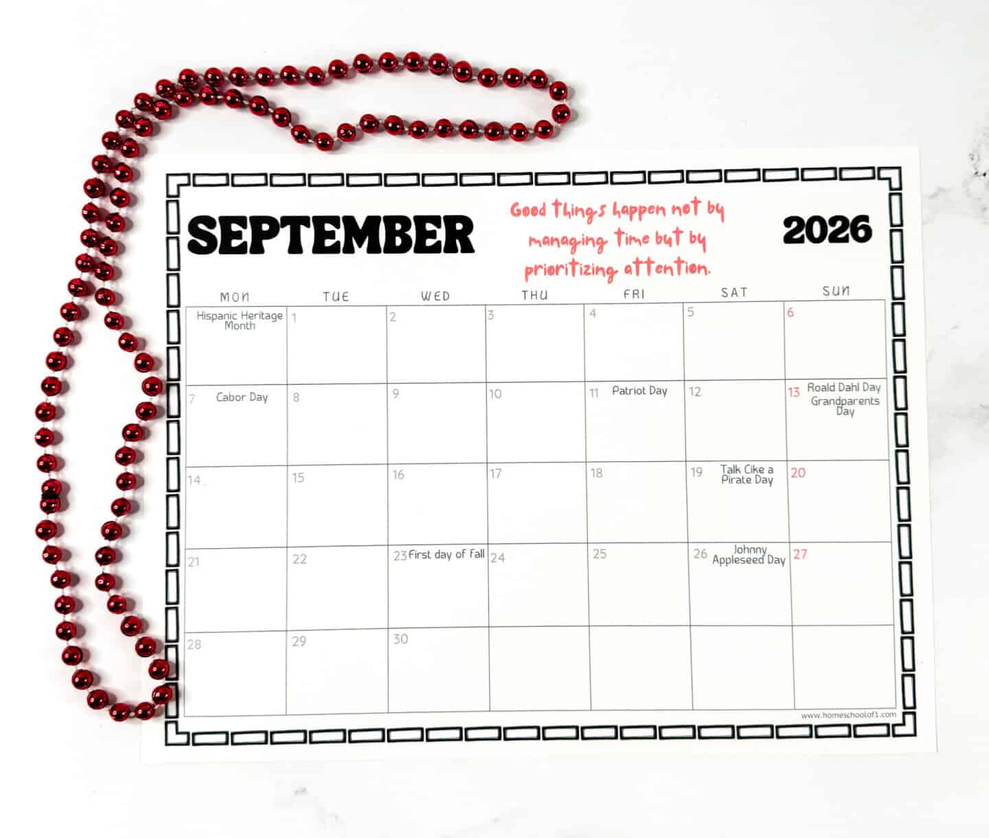 September 2026 printable calendar page showing holidays like Labor Day, Patriot Day, and Johnny Appleseed Day, with red bead decoration.