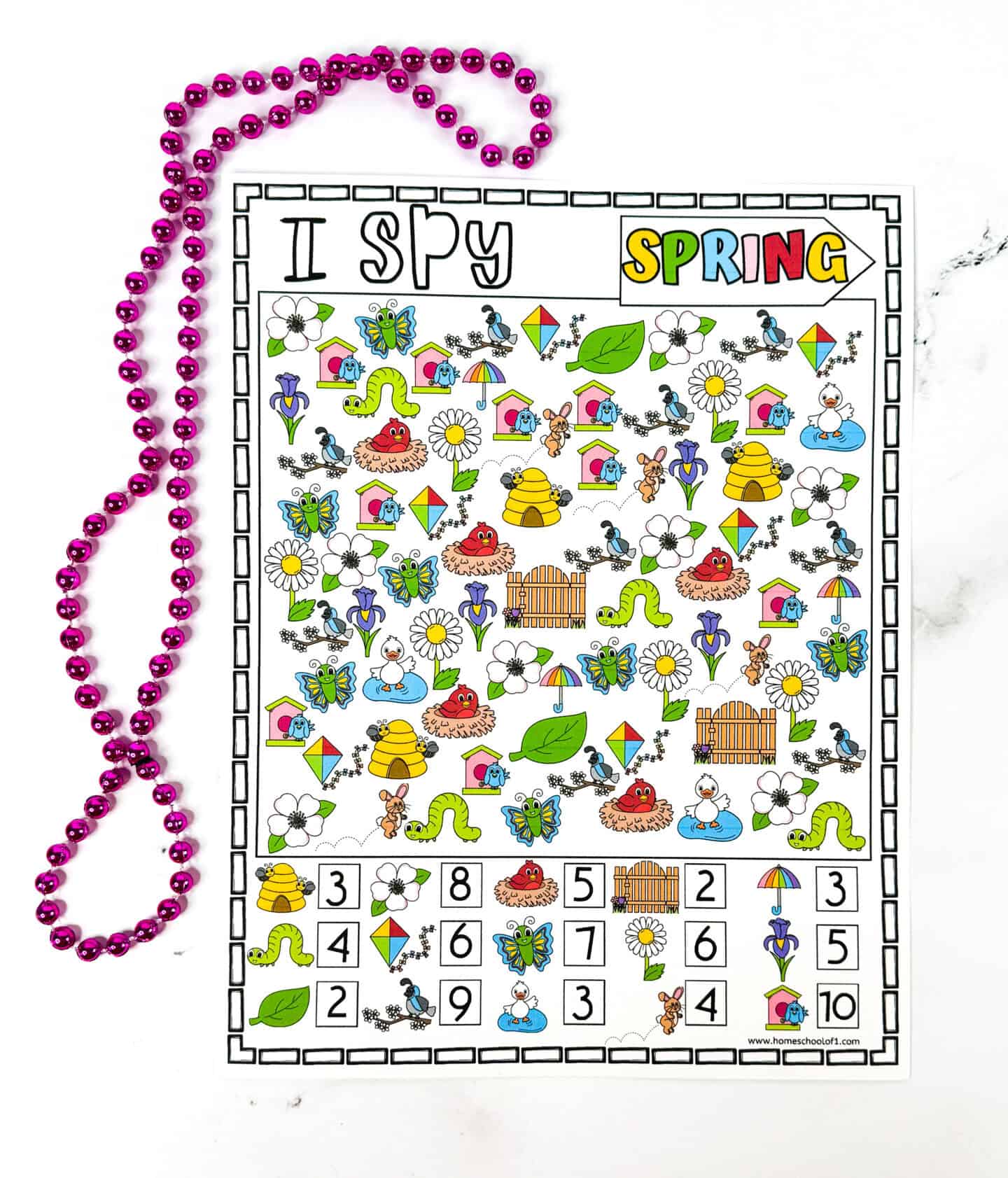 Vibrant Spring I Spy printable filled with colorful icons like butterflies, bees, worms, kites, ducks, flowers, and birdhouses, along with a counting section at the bottom. The worksheet is topped with bold "I Spy Spring" text and is decorated with a looped pink beaded necklace on a white background.

