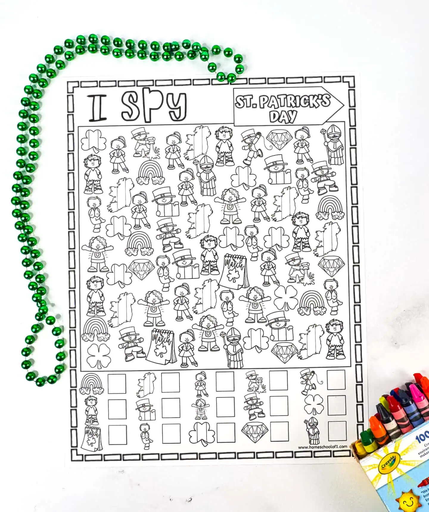 Black-and-white St. Patrick’s Day I Spy coloring page for kids to color and count different festive objects.