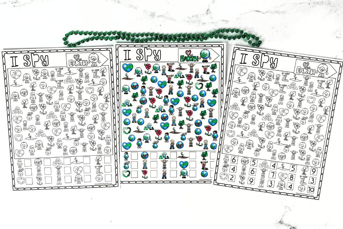 Three Earth Day I Spy printable worksheets laid out side-by-side, featuring eco-themed graphics like Earths, recycling symbols, trees, and kids celebrating nature. The middle sheet is fully colored while the outer two are in black and white, perfect for a fun and educational Earth Day classroom activity or homeschool game.