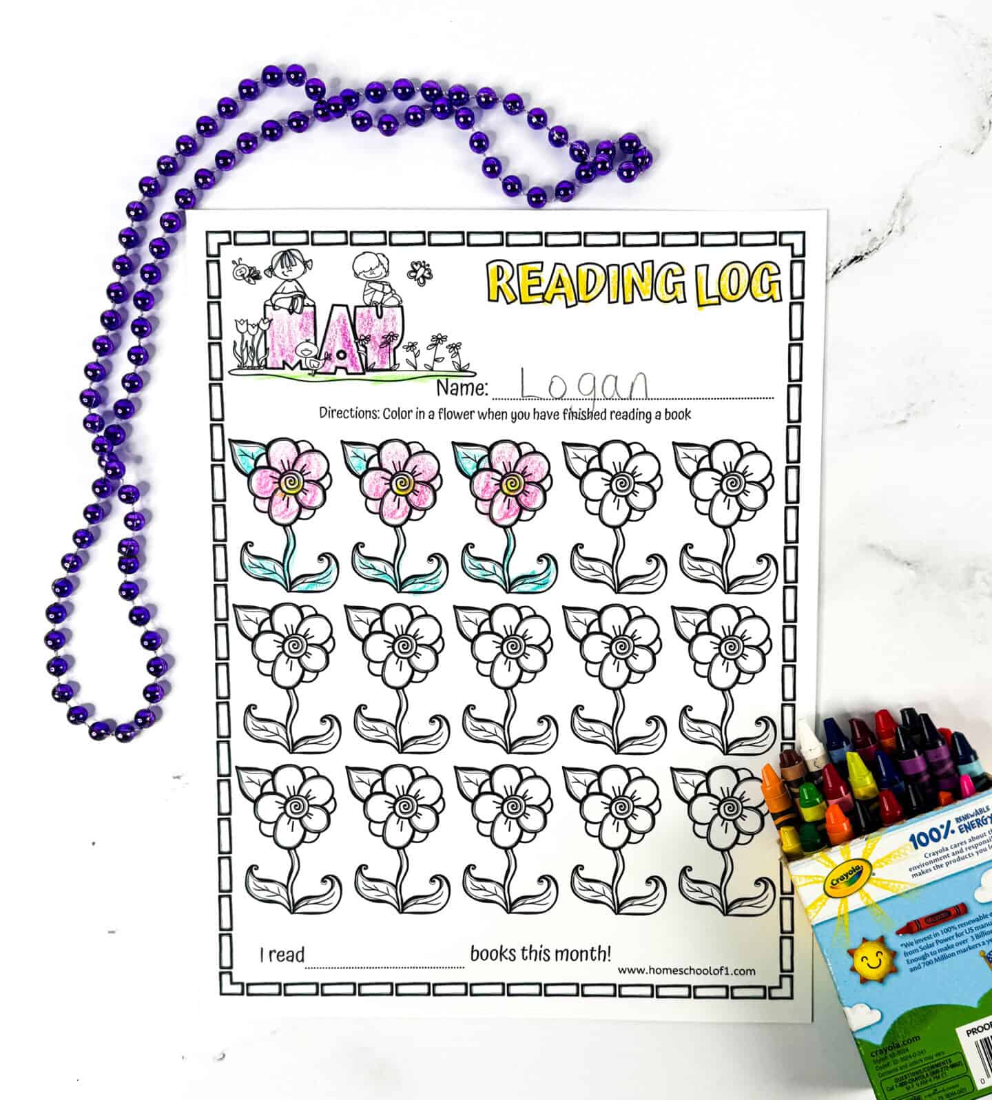 A printable May reading tracker with flower illustrations, lightly colored with crayons and surrounded by purple beads. This book log encourages kids to read by coloring a flower each time they finish a book.