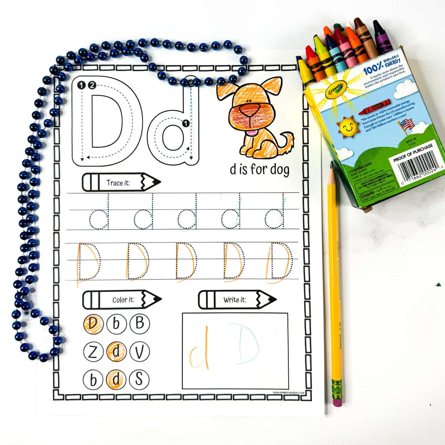 Letter D tracing worksheet with a dog illustration, uppercase and lowercase tracing lines, letter identification circles, and writing box.