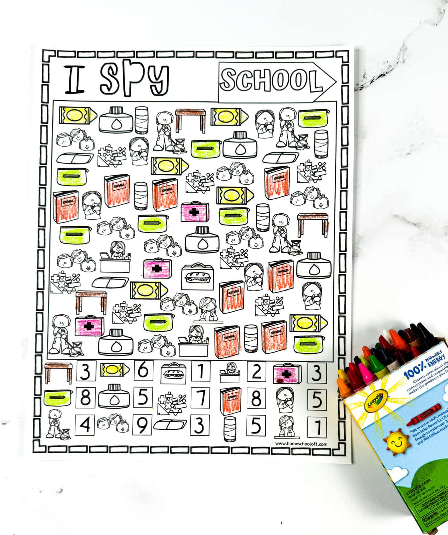 Partially colored Back to School I Spy worksheet featuring hand-drawn school supplies and number boxes, with a box of Crayola crayons on the side. Great printable for early math and classroom prep.