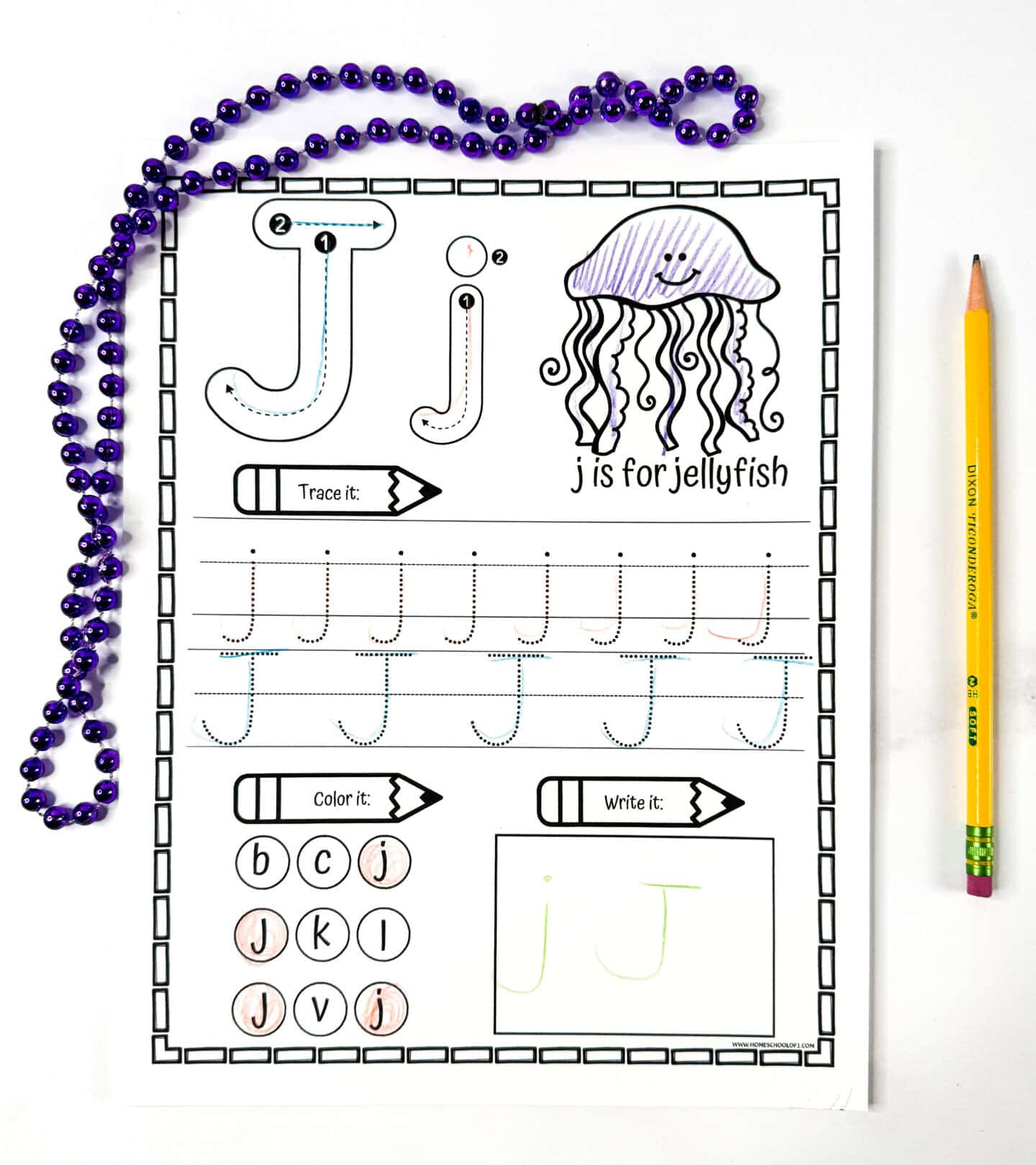 Letter J tracing worksheet featuring a jellyfish image, tracing practice for both cases, a coloring task, and letter writing space.
