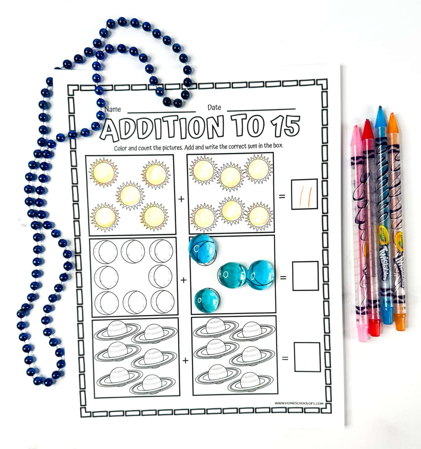Addition to 15 worksheet featuring suns, moons, and planets to color while practicing sums for first grade students.