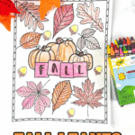 Colored fall leaves coloring page with pumpkins and acorns, featuring the word “FALL” in block letters. Surrounded by crayons and autumn decor.