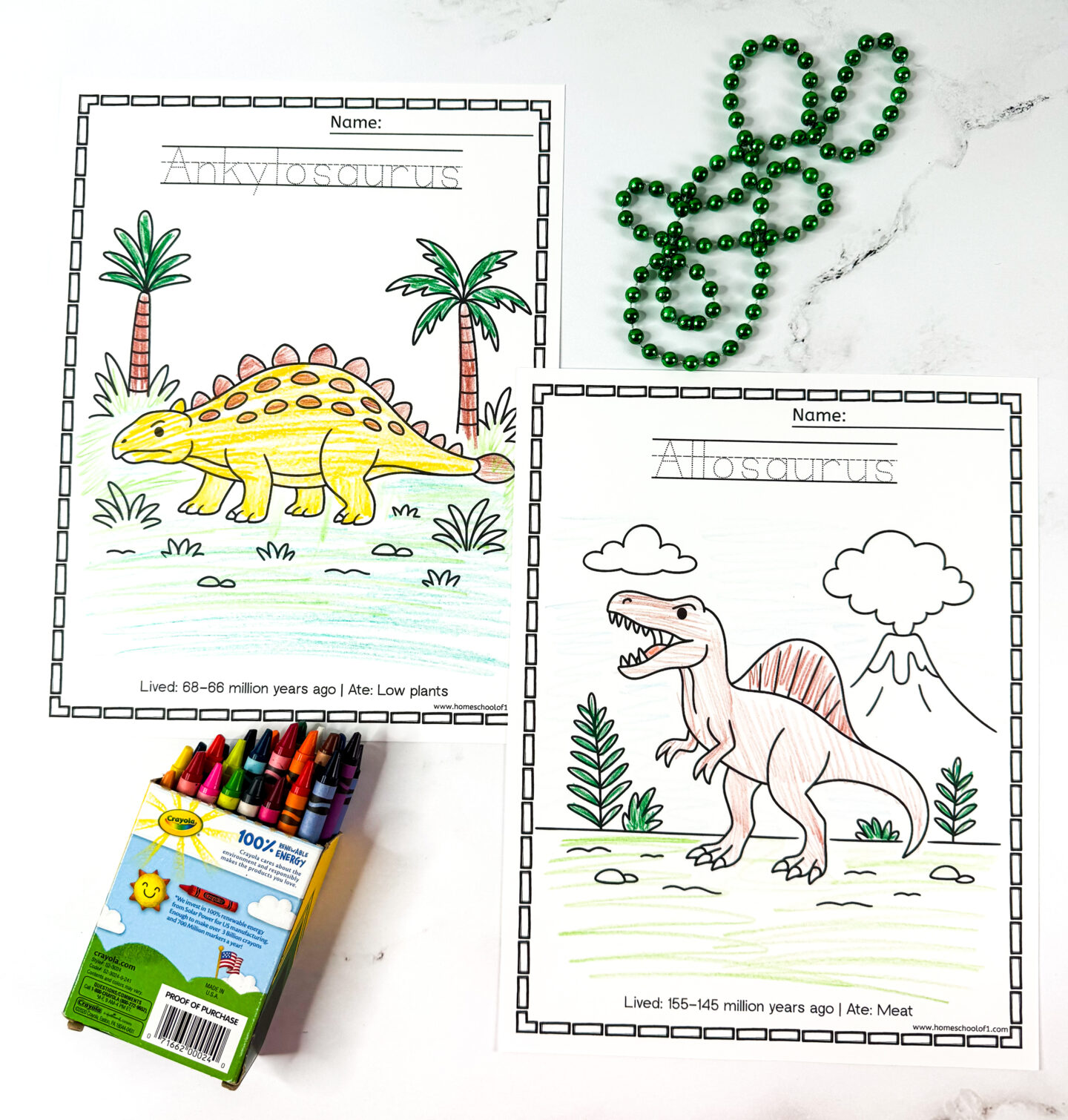 Two dinosaur coloring pages for kids featuring Ankylosaurus and Allosaurus with tracing lines and fact boxes, plus crayons and green beads.