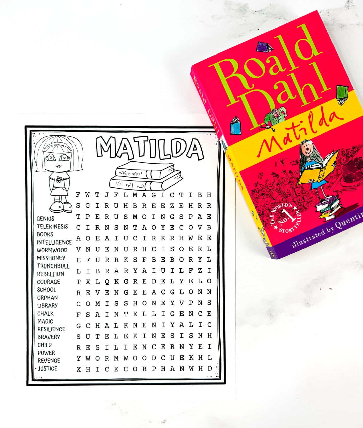 Black and white Matilda word search puzzle featuring vocabulary from Roald Dahl’s story, placed beside a bright pink and yellow Matilda book.
