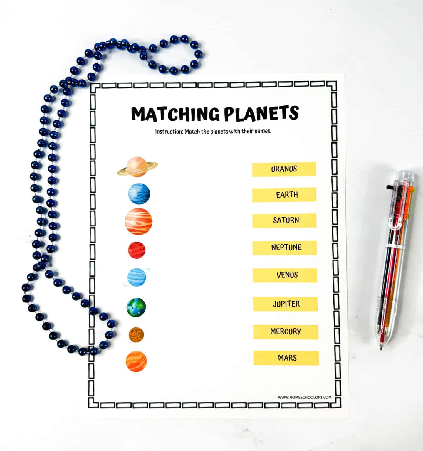 Solar system matching worksheet showing colorful planet images on the left and name labels on the right for kids to connect.