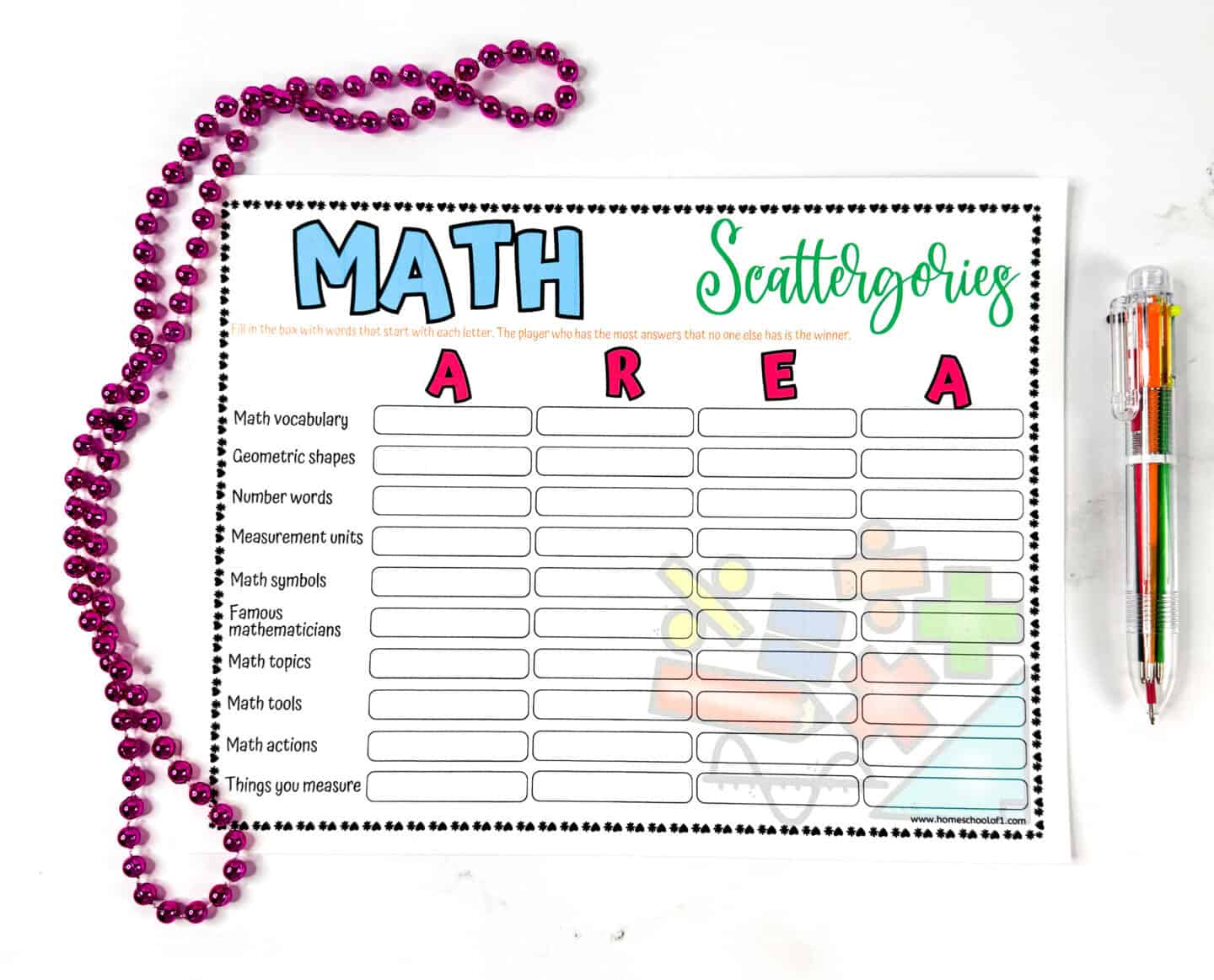 Printable Math Scattergories game sheet with the letters A, R, E, A at the top and ten math-related categories to fill in. A pink beaded necklace is placed on the left, and a multi-colored pen is on the right.